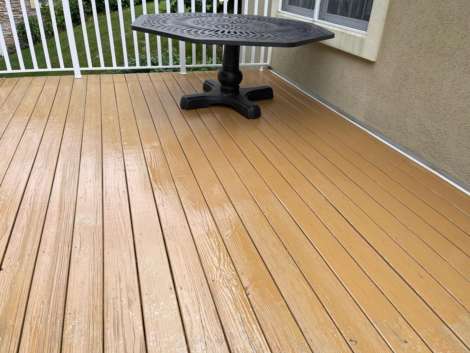 Backyard deck freshly stained in warm tan